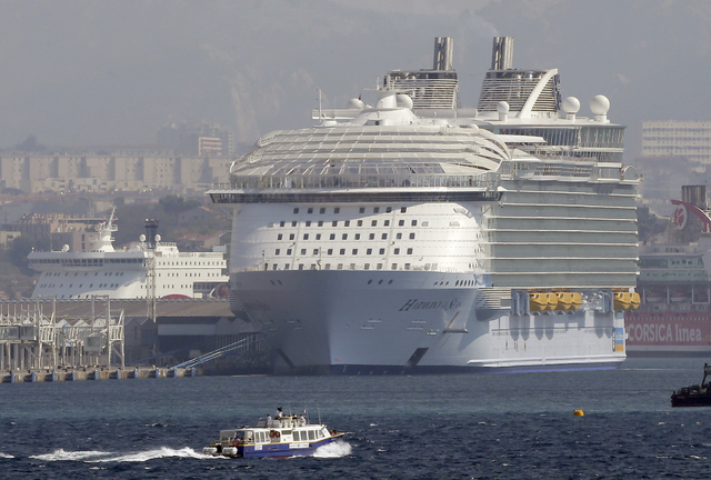 The Harmony of the Seas is docked in Marseille harbor, southern France, Tuesday, Sept. 13, 2016. Royal Caribbean cruise line says a crewmember has died during a lifeboat drill being conducted in M ...
