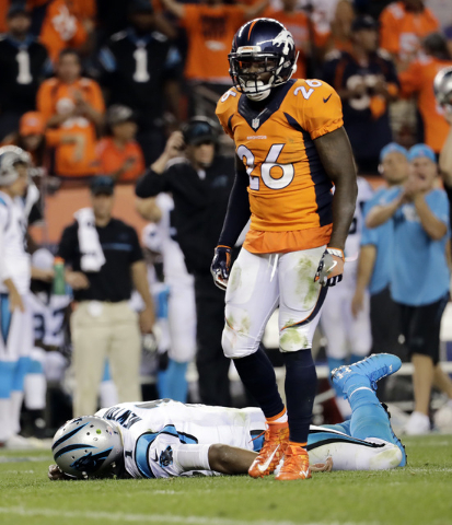 In this Sept. 8, 2016, file photo, Carolina Panthers quarterback Cam Newton (1) lies on the turf after a roughing the passer penalty was called on Denver Broncos free safety Darian Stewart (26) du ...