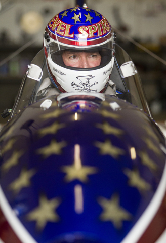 In a Thursday, Sept. 1, 2016 photo, stuntman Eddie Braun gives feedback after getting into the cockpit of The Evel Spirit, a steam powered rocket, at the team's shop in Twin Falls, Idaho. Braun is ...