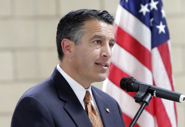 Gov. Brian Sandoval speaks during a homecoming ceremony for the Nevada Army National Guard's 72nd Military Police Company at North Las Vegas Readiness Center Friday, 13, 2016. (Bizuayehu Tesfaye/L ...