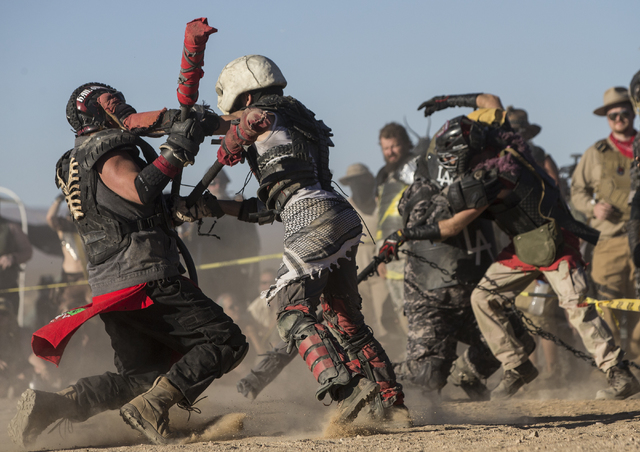 Competitors take part in a jugger match during the seventh annual Wasteland Weekend on Friday, Sept. 23, 2016, in California City, Calif. The four day, post-apocalyptic festival takes place in the ...