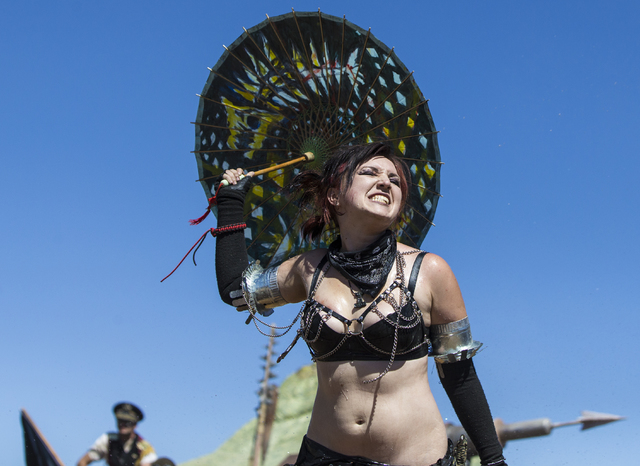 Contestants engage the crowd during the post-apocalyptic swimsuit contest during the seventh annual Wasteland Weekend on Saturday, Sept. 24, 2016, in California City, Calif. The four day, post-apo ...