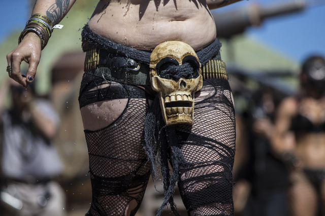 A contestant shows off her hand-made outfit during the post-apocalyptic swimsuit contest during the seventh annual Wasteland Weekend on Saturday, Sept. 24, 2016, in California City, Calif. The fou ...