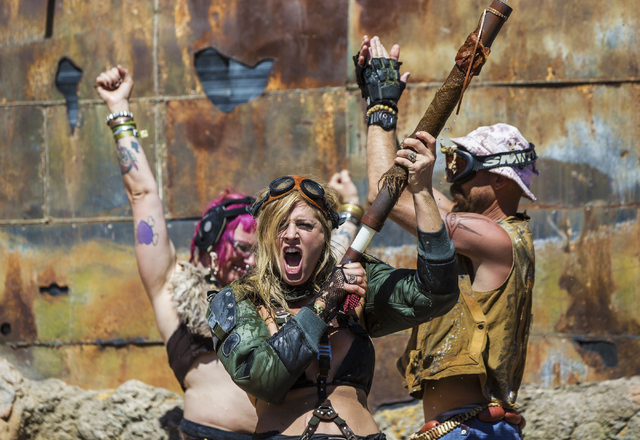 The crowd erupts at the conclusion of the post-apocalyptic swimsuit contest during the seventh annual Wasteland Weekend on Saturday, Sept. 24, 2016, in California City, Calif. The four day, post-a ...