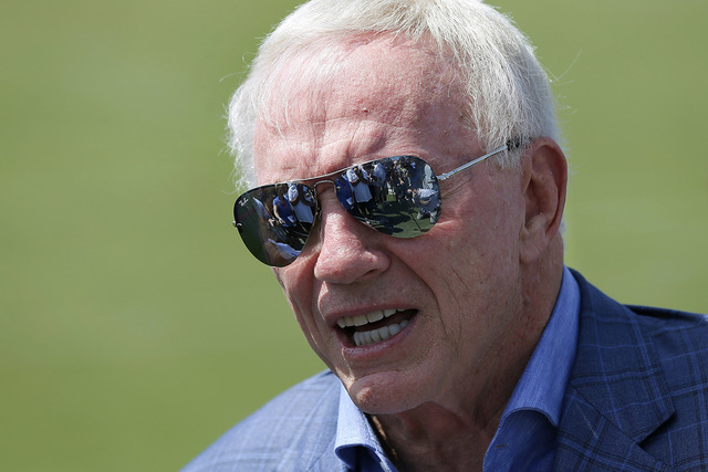 Dallas Cowboys team owner Jerry Jones talks with reporters after arriving at the team's headquarters and training complex on his new personal helicopter, Thursday, Sept. 8, 2016, in Frisco, Texas. ...