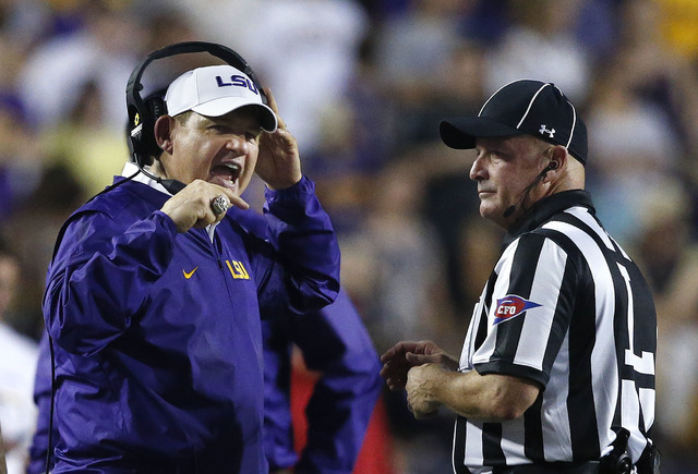 LSU head coach Les Miles talks to an official in the second half of an NCAA college football game against Jacksonville State in Baton Rouge, La., Saturday, Sept. 10, 2016. LSU won 34-13. (Gerald H ...