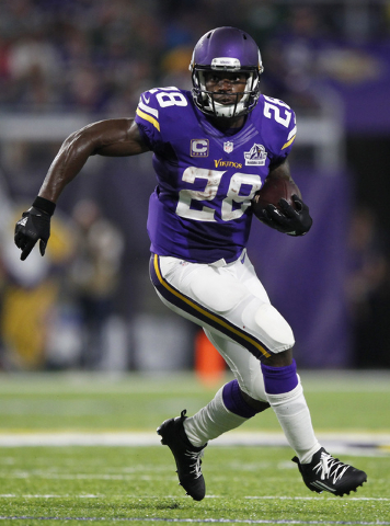 Minnesota Vikings running back Adrian Peterson carries the ball during the first half of an NFL football game against the Green Bay Packers Sunday, Sept. 18, 2016, in Minneapolis. (Andy Clayton-Ki ...