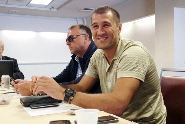 Light heavyweight champion Sergey Kovalev, right, responds to a question during an interview alongside his manager, Egis Klimas, in Los Angeles on Saturday, April 23, 2016. Kovalev, of Russia, has ...