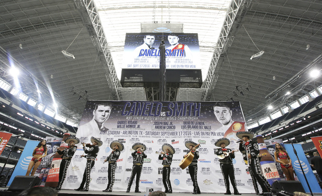 Mariachis play on the stage before the Canelo Alvarez and Liam Smith official weigh-in for the upcoming tittle fight at the stadium in Arlington, Texas, Thursday, Sept. 15, 2016. (LM Otero/AP)