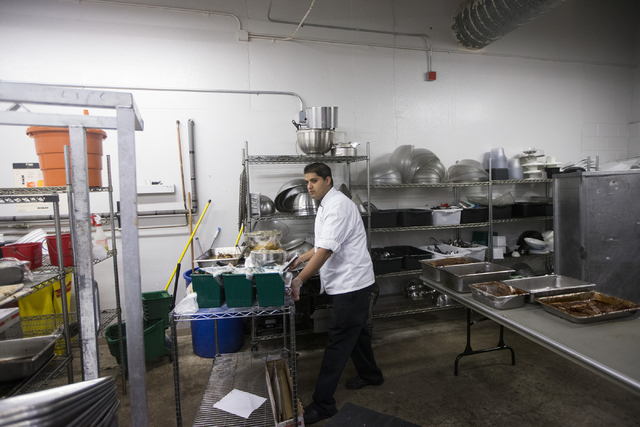 Chef Chandi Ilangantileke prepares the kitchen before the start of the last home game of the season for the Las Vegas 51s at Cashman Field on Saturday, Aug. 27, 2016, in Las Vegas. (Erik Verduzco/ ...