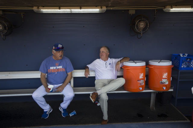 Las Vegas 51s manager Wally Backman, left, and president Don Logan speak to each other at the team dugout before the start of the last home game of the season on Saturday, Aug. 27, 2016, in Las Ve ...