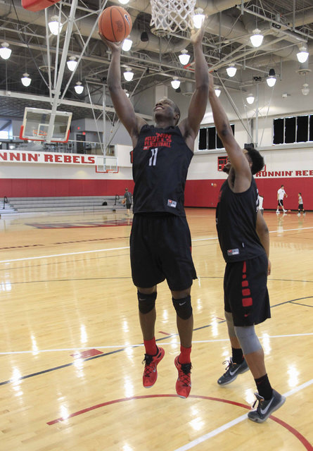 UNLV's Cheickna Dembele (11) shoots over Uche Ofoegbu during team practice at the Mendenhall Center at UNLV in Las Vegas on Monday, Aug. 8, 2016. (Richard Brian/Las Vegas Review-Journal) Follow @v ...