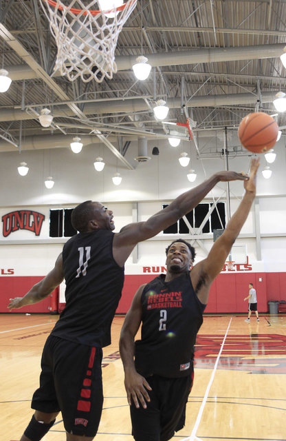 UNLV's Uche Ofoegbu (2) shoots over Cheickna Dembele (11) during team practice at the Mendenhall Center at UNLV in Las Vegas on Monday, Aug. 8, 2016. (Richard Brian/Las Vegas Review-Journal) Follo ...