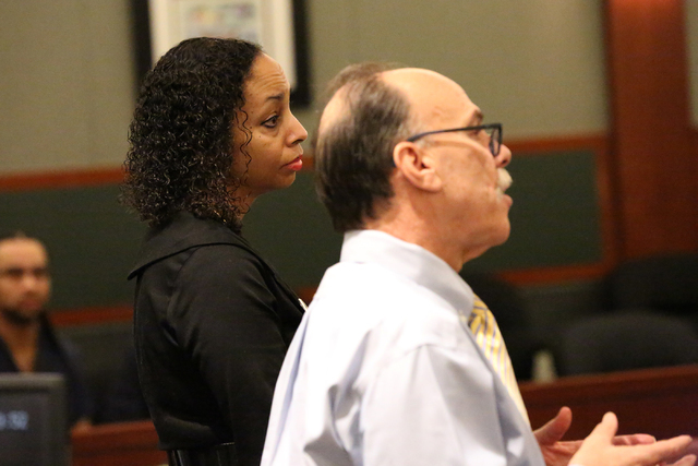 Clark County Public Defender Phil Kohn, right, asks why Erika Ballou should not be allowed to wear a Black Lives Matter pin in the courtroom of District Judge Douglas Herndon on Tuesday, Sept. 20, ...