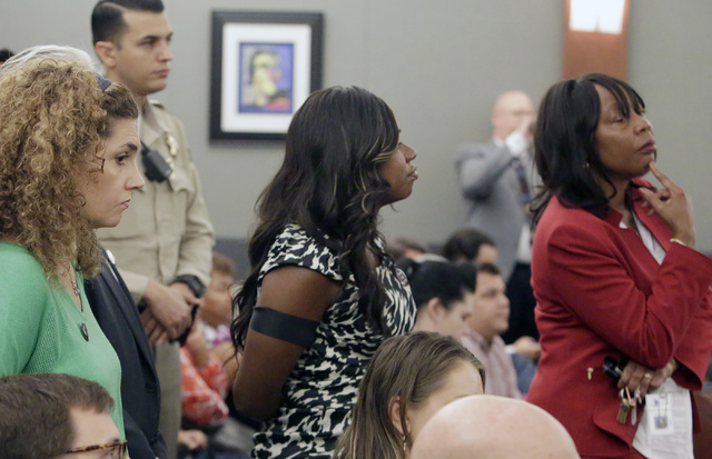 Public defenders, including Belinda Harris, center, wearing a Black Lives Matter button, listen as Erika Ballou, not photographed, presents her argument Thursday, Sept. 22, 2016, at the Regional J ...
