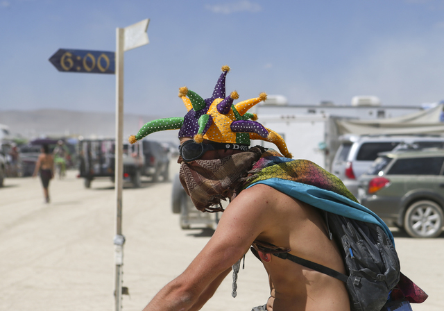 A man passes by during Burning Man at the Black Rock Desert north of Reno on Wednesday, Aug. 31, 2016. Chase Stevens/Las Vegas Review-Journal Follow @csstevensphoto