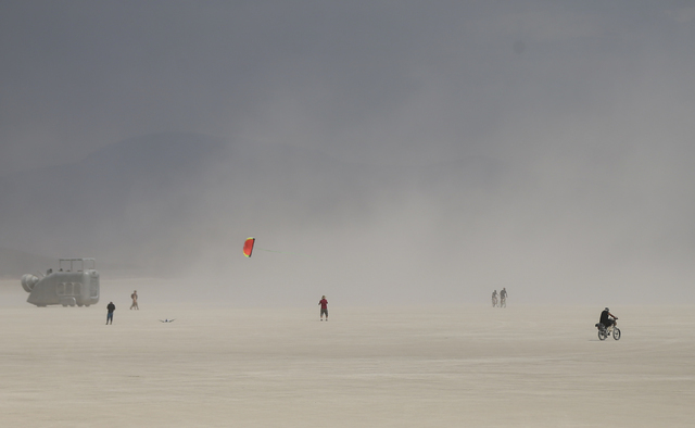 A man flies a kite on the playa during Burning Man at the Black Rock Desert north of Reno on Wednesday, Aug. 31, 2016. Chase Stevens/Las Vegas Review-Journal Follow @csstevensphoto