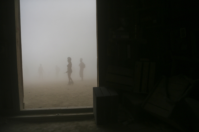 Attendees are silhouetted as a dust storm moves along the playa during Burning Man at the Black Rock Desert north of Reno on Thursday, Sept. 1, 2016. Chase Stevens/Las Vegas Review-Journal Follow  ...