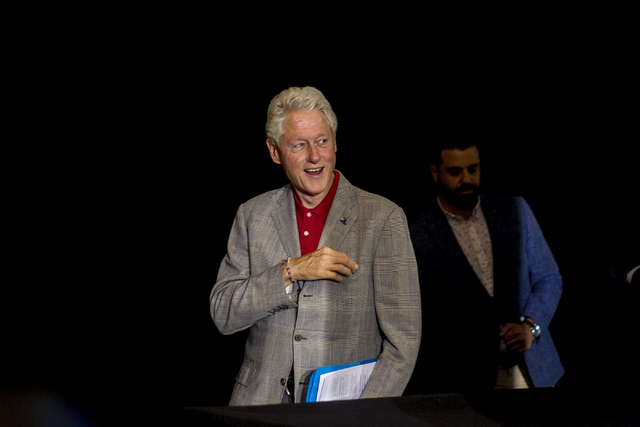 Former President Bill Clinton walks takes the stage to campaign on behalf of Democratic presidential nominee Hillary Clinton at the College of Southern Nevada in North Las Vegas, Sept. 14, 2016. E ...