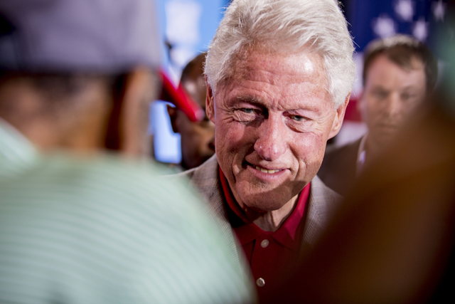 Former President Bill Clinton greets supporters while campaigning on behalf of Democratic presidential nominee Hillary Clinton at the College of Southern Nevada in North Las Vegas, Wednesday, Sept ...