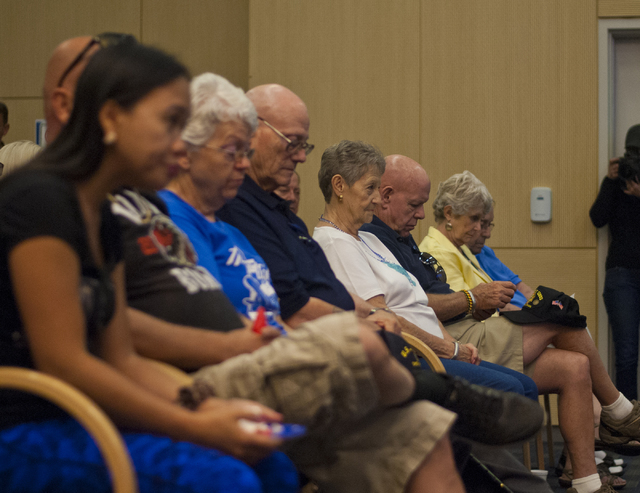 Audience members take a moment of silence before the Six-String Soldiers perform in honor of National POW-MIA Recognition Day at the VA Medical Center in North Las Vegas on Thursday, Sept. 15, 201 ...