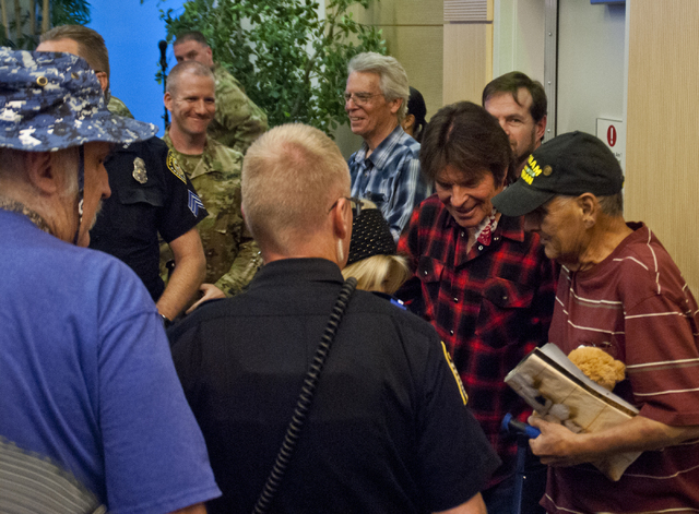 John Fogerty of Creedence Clearwater Revival fame meets with audience members after performing with the Six-String Soldiers in honor of National POW-MIA Recognition Day at the VA Medical Center in ...
