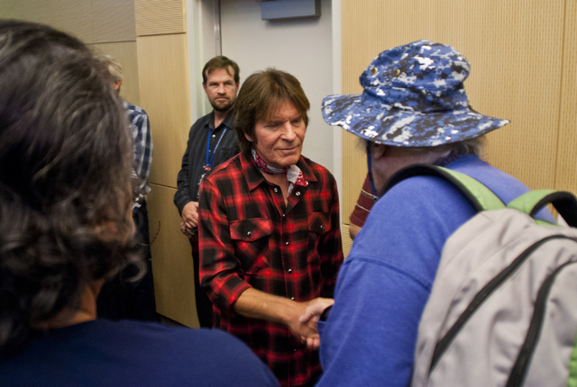 John Fogerty of Creedence Clearwater Revival fame meets with audience members after performing with the Six-String Soldiers in honor of National POW-MIA Recognition Day at the VA Medical Center in ...