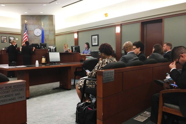 Attorneys sit in District Judge Douglas Herndon's courtroom on Tuesday, Sept. 20, 2016, as other lawyers approach the bench. (David Ferrara/Las Vegas Review-Journal)