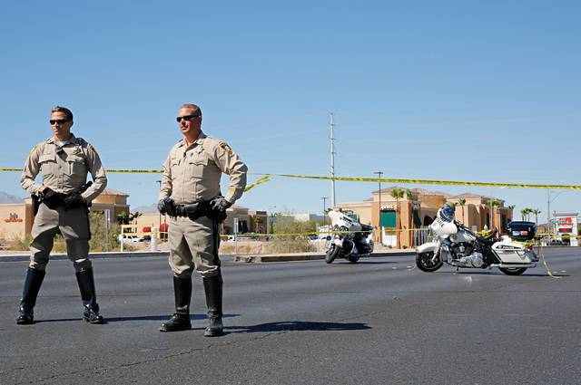 Police officers block off Rainbow Blvd. in Las Vegas, Sunday, Sept. 25, 2016, after a shooting inside a Starbucks at a southwest valley strip mall.  Chitose Suzuki/Las Vegas Review-Journal