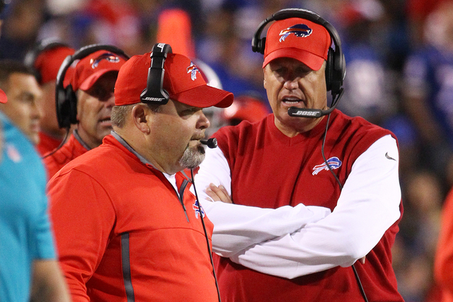 Buffalo Bills offensive coordinator Greg Roman, left, and head coach Rex Ryan, right, work the sidelines during the first half of an NFL football game against the New York Jets on Thursday, Sept.  ...