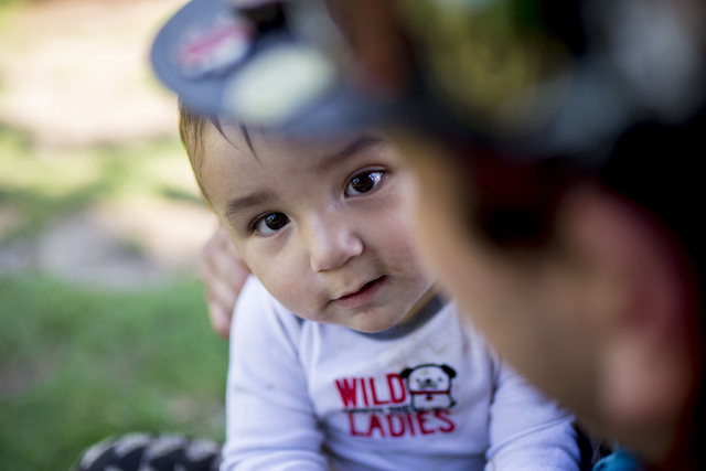 Killian, an infant raised by his parents along with a community that dwells at Common Park in Denver Colorado, his held by his father, Snoopy Thursday, Sept. 1, 2016.  &quot;I have found such  ...