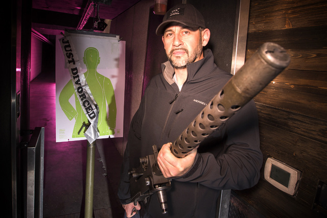 Machine Guns Vegas owner Genghis Cohen holds a M1919 Browning mounted belt-fed machine gun in the private indoor shooting range at  3501 Aldeberan Avenue on Thursday, Jan. 29, 2015. (Jeff Scheid/L ...