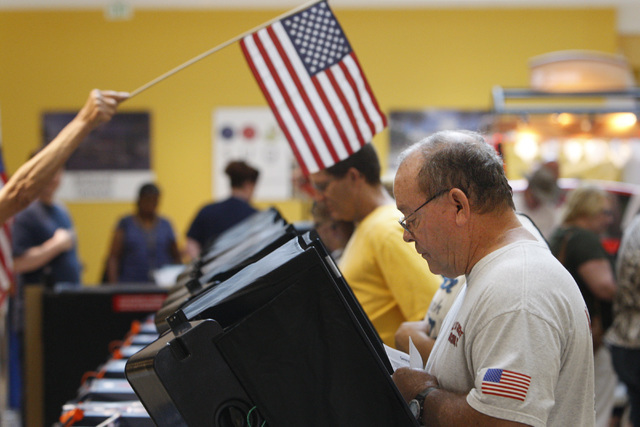 Paul Sonner casts his ballot during early voting at the Galleria Mall in Henderson Saturday, Oct. 18, 2014.  (Sam Morris/Las Vegas Review-Journal)