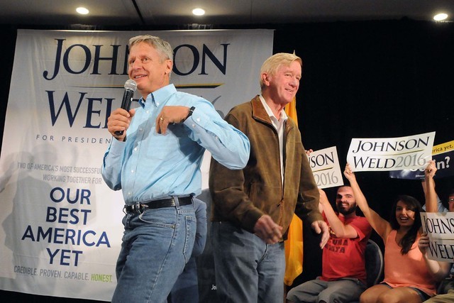 Libertarian presidential candidate and former New Mexico Gov. Gary Johnson. left, takes the stage at the Albuquerque Convention Center after being introduced by his running mate Bill Weld during a ...