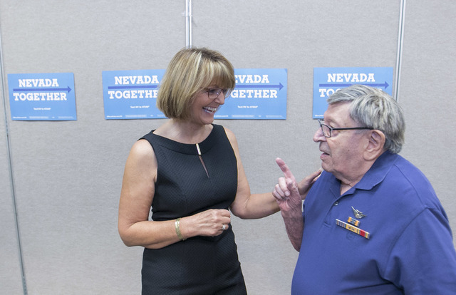 Retired Air Force Maj. Gen. Margaret Woodward speaks to World War II veteran Howard Landers following a roundtable discussion of national security at the Silver Mesa Recreation Center in North Las ...