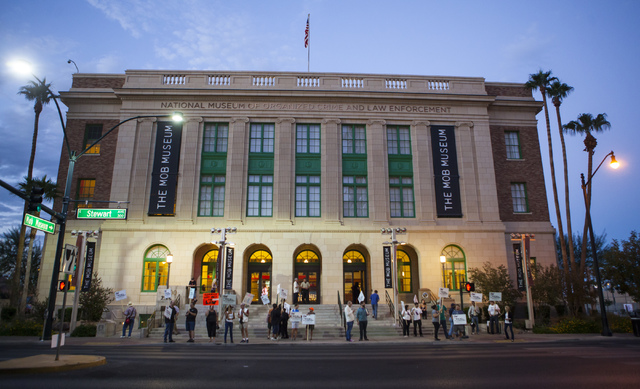 People rally outside of the Mob Museum ahead of a town hall discussion on Question 1 in Las Vegas on Thursday, Sept. 29, 2016. Question 1 is the Nevada State ballot initiative to expand firearm ba ...