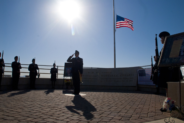 Members of the Palo Verde High School Air Force JROTC honor the victims of the 9/11 attacks with a flag rededication ceremony at the Barbara Edwards Memorial on campus in Las Vegas on Friday, Sep ...