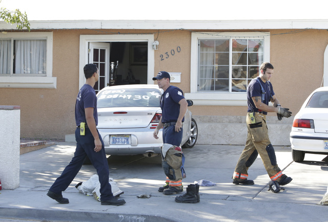Las Vegas firefighters prepare to leave after fighting a house fire where one man died at 2300 Dori Ave., on Wednesday, Sept. 14, 2016. (Bizuayehu Tesfaye/Las Vegas Review-Journal Follow @bizutesfaye)