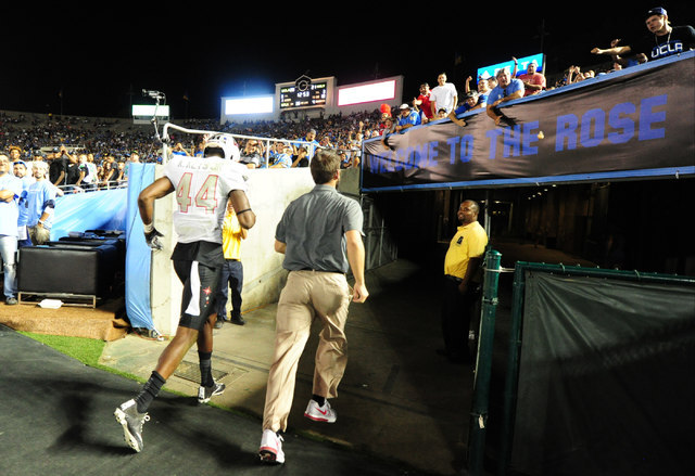UNLV Rebels defensive back Kenny Keys (44) exits the field after targeting UCLA Bruins wide receiver Eldridge Massington (82) in the second half of their NCAA college football game at the Rose Bow ...