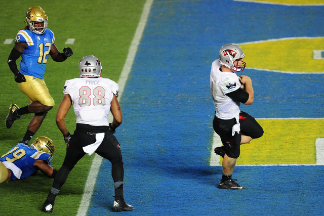 UNLV Rebels quarterback Johnny Stanton (4) rushes for a touchdown against UCLA in the second half of their NCAA college football game at the Rose Bowl in Pasadena, Calif. Saturday Sept. 10, 2016. ...