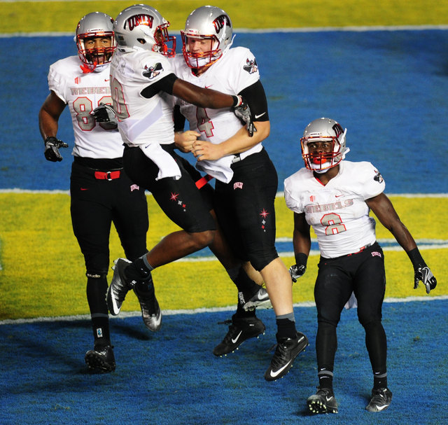 UNLV Rebels wide receiver Darren Woods Jr. (10) celebrates with quarterback Johnny Stanton (4) after Stanton rushed for a touchdown against UCLA in the second half of their NCAA college football g ...