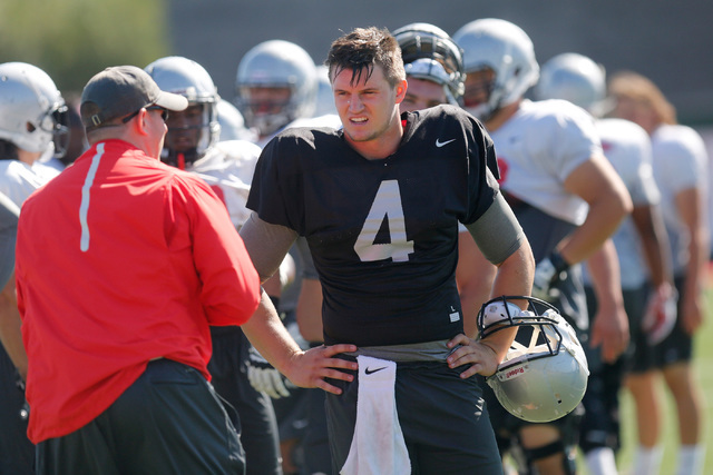 UNLV quarterback Johnny Stanton (4) listens to a coach during practice at Rebel Park in Las Vegas, Tuesday, Sept. 13, 2016. (Chitose Suzuki/Las Vegas Review-Journal)