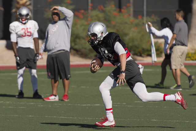 Dalton Sneed (18) runs will the football during practice at UNLV's Rebel Park in Las Vegas, Tuesday, Sept. 27, 2016. (Jason Ogulnik/Las Vegas Review-Journal)