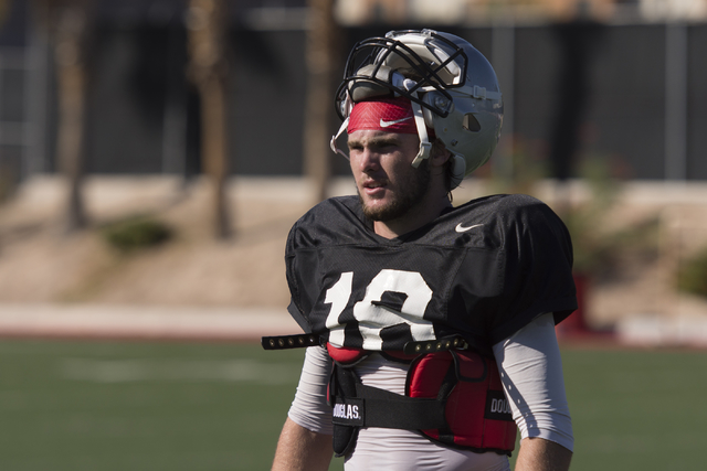 Dalton Sneed (18) takes a rest during football practice at UNLV's Rebel Park in Las Vegas, Tuesday, Sept. 27, 2016. (Jason Ogulnik/Las Vegas Review-Journal)
