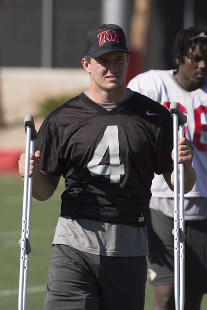 Johnny Stanton (4) stands on crutches during football practice at UNLV's Rebel Park in Las Vegas, Tuesday, Sept. 27, 2016. (Jason Ogulnik/Las Vegas Review-Journal)
