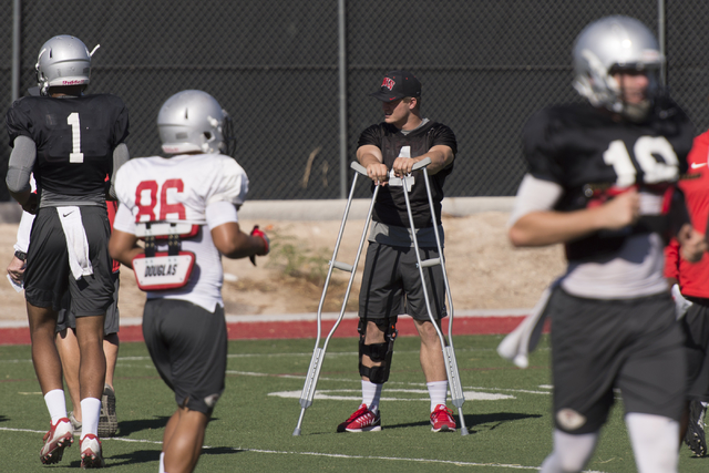 Johnny Stanton (4) stands on crutches during football practice at UNLV's Rebel Park in Las Vegas, Tuesday, Sept. 27, 2016. (Jason Ogulnik/Las Vegas Review-Journal)