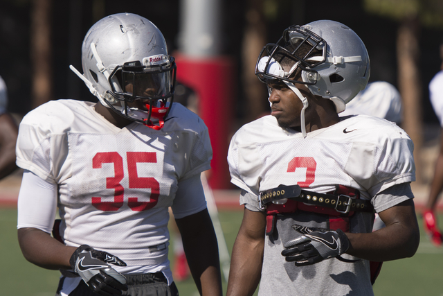 Lexington Thomas (3), right, talks with Xzaviar Campbell (35) during football practice at UNLV's Rebel Park in Las Vegas, Tuesday, Sept. 27, 2016. (Jason Ogulnik/Las Vegas Review-Journal)