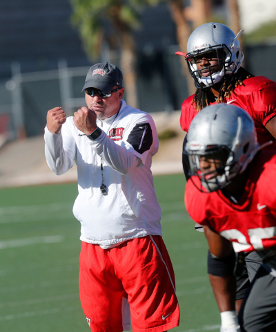 UNLV football coach Tony Sanchez, left, watches a team drill during practice at Rebel Park in Las Vegas, Tuesday, Sept. 13, 2016. (Chitose Suzuki/Las Vegas Review-Journal)