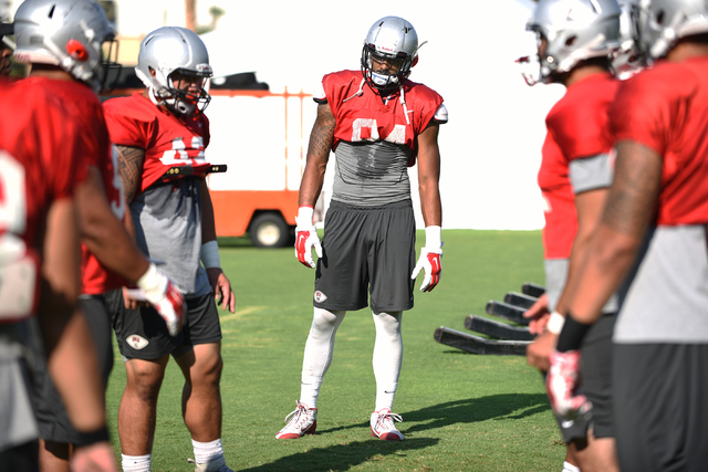 Defensive end Jeremiah Valoaga (94), center, at football practice at Rebel Park inside the UNLV campus in Las Vegas on Thursday, Aug. 25, 2016. (Martin S. Fuentes/Las Vegas Review-Journal)