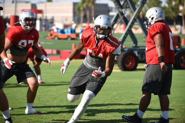 Defensive end Jeremiah Valoaga (94) runs a play during football practice at Rebel Park inside the UNLV campus in Las Vegas on Thursday, Aug. 25, 2016. (Martin S. Fuentes/Las Vegas Review-Journal)